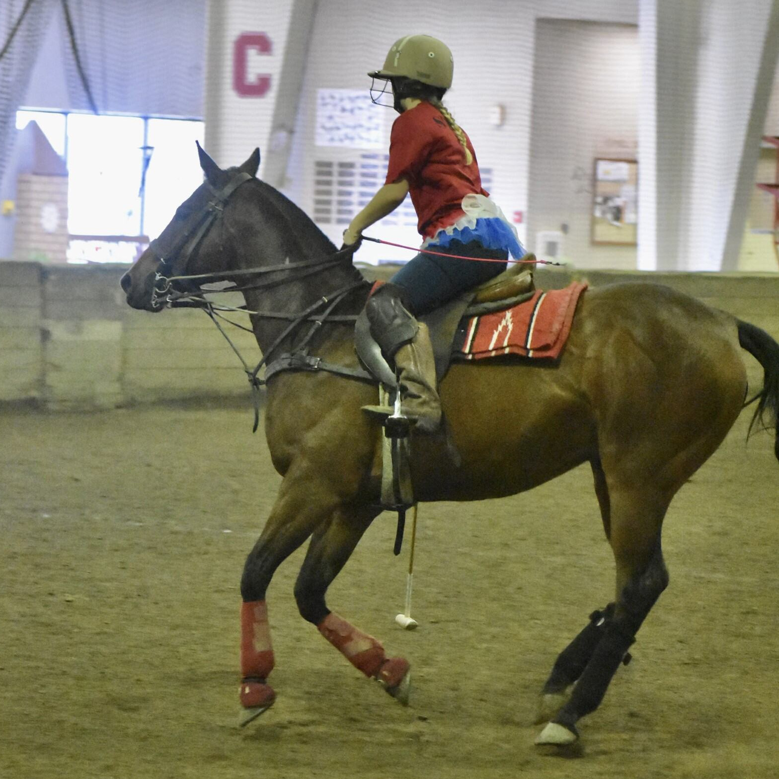 A woman riding a horse